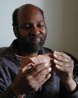 Savant Alonzo Clemons  cretes a sculpture